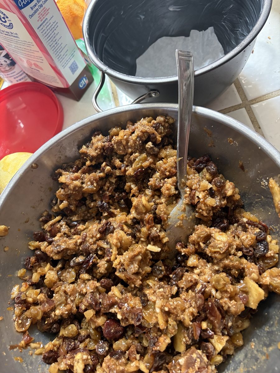 Christmas pudding mixture being prepared in a kitchen